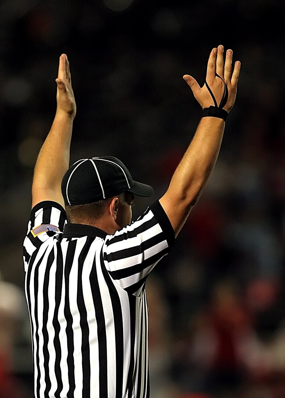 referee raising both hands