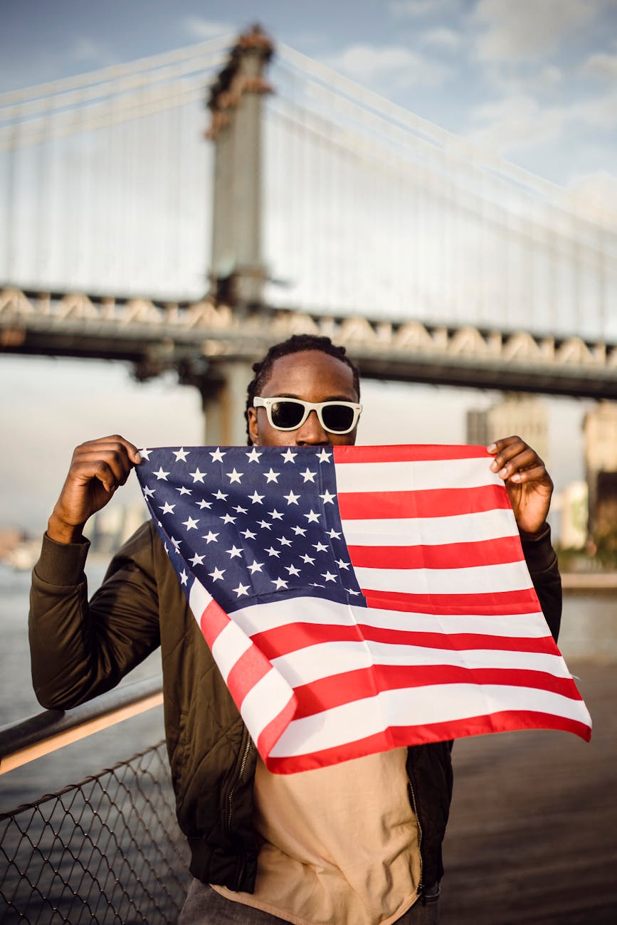 young african american male with american flag bandana on waterfront
