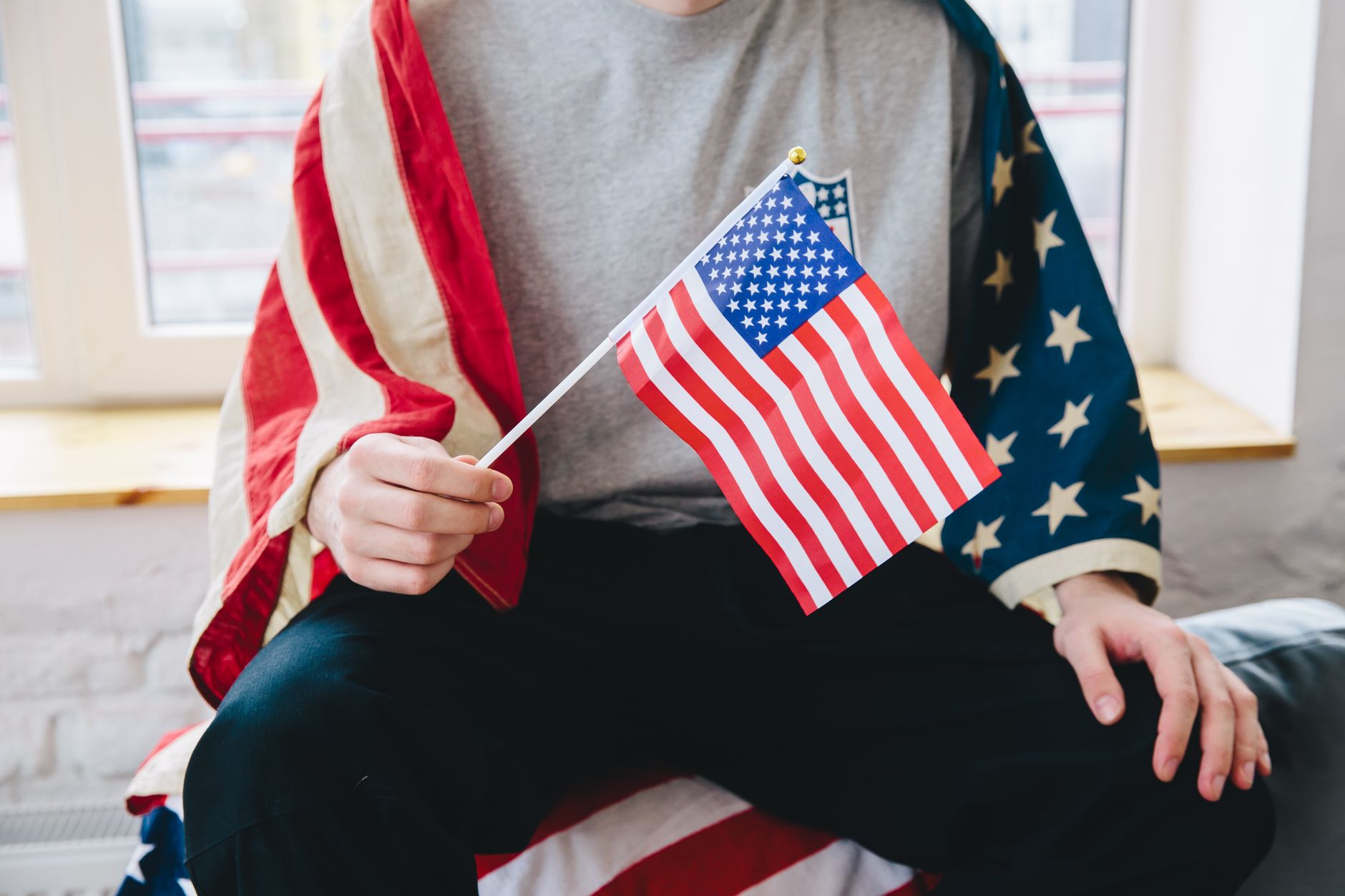 person holding a flag of america